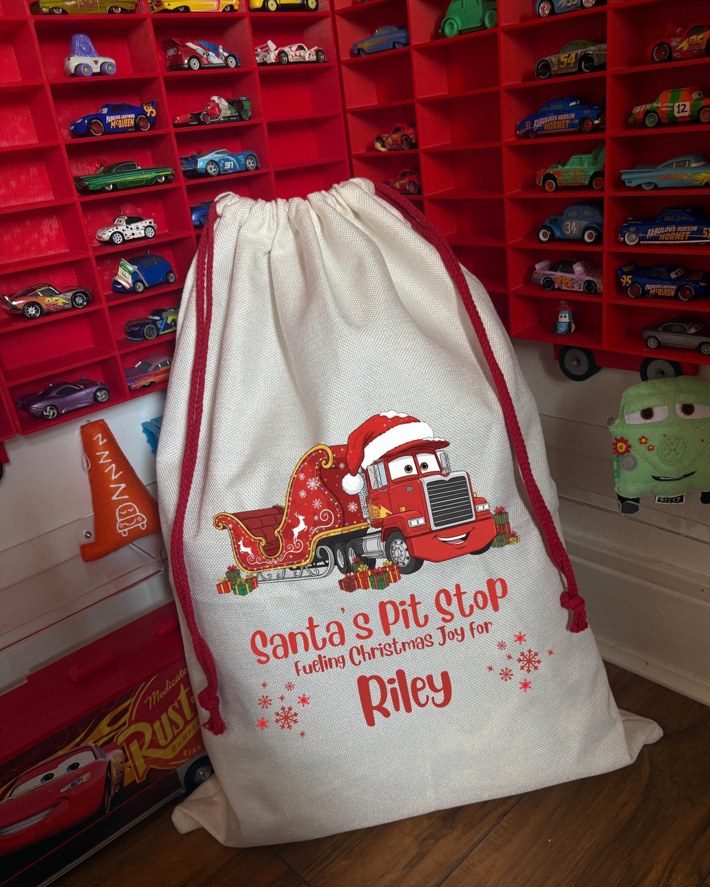 Disney Cars Santa’s Pit Stop Mack Personalised Christmas Sack  - every sack comes with a matching bauble